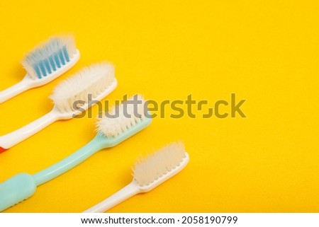 Techniques for storing toothbrushes and cleaning brushes after use to reduce the accumulation of germs and bacteria