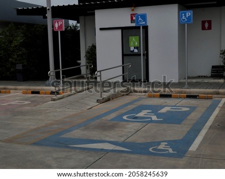 The parking lot for people with disabilities is marked in blue. 
