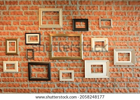 Many wooden photo frames mockup, set collection on bricks wall, interior decor
