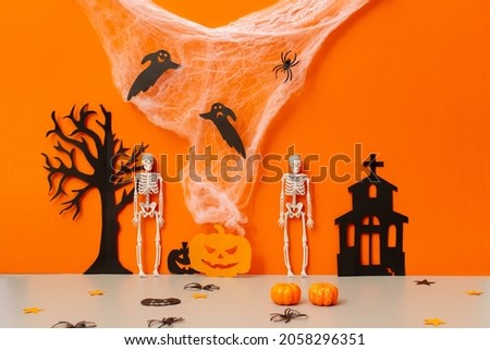 halloween background with pumpkin, bats, and skeletons
