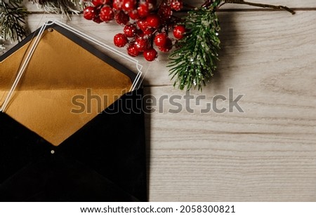 Festive Christmas and new year black gift certificate on light wooden background