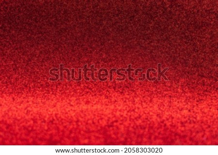 Abstract red glitter background with defocus