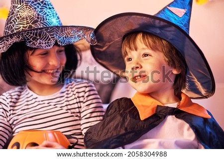 Portraits of a boy and a girl in Halloween outfits. Happy children 