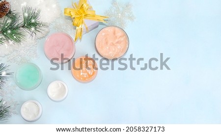 Spa and wellness composition, a set of creams for winter skin care on a light background with a place for text, a banner for advertising a store, salon, cosmetics.Modern woman concept, selective focus