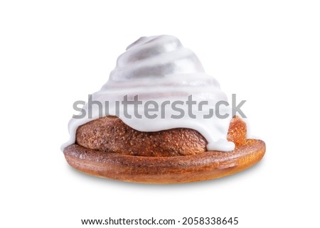 Roll cinnamon bun with weet sugar glaze on a white isolated background. toning. selective focus