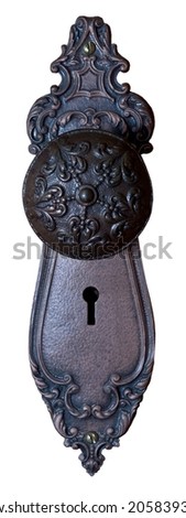 Close-up photo of beautiful ornate metal doorknob with skeleton keyhole isolated on white background.