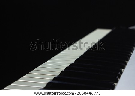 Synthesizer keys on a black background. Close-up keys. Musical instrument