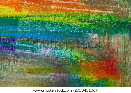 abstract rainbow multicolored background formed by erasing paints from the canvas, short focus. Not an art object, temporary effect. 