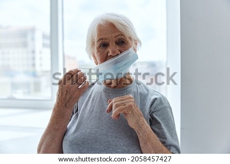 elderly woman medical mask breathing protection