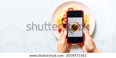 Mobile phone to take pictures of spaghetti,Taking food photo, food photography by mobile smart phone, Spicy Stir Fry Spaghetti
