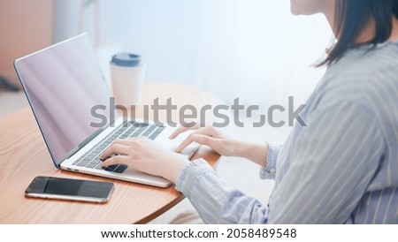 
Image of a woman using a laptop computer Royalty-Free Stock Photo #2058489548