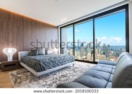 Modern and contemporary bedroom in Montreal with views of the financial district of the city. Condo or Hotel accommodation.