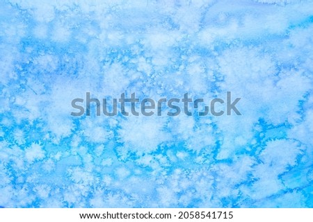 watercolor blue abstract art handmade diy painting on textured paper background. watercolour backdrop. painted frosty ice cold surface with cloud spots