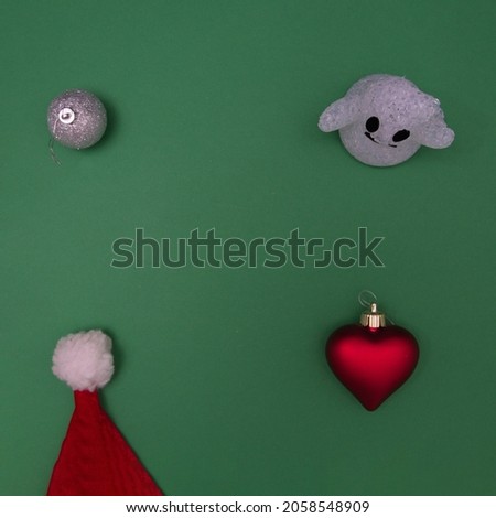 New Year's decorations for decoration with the spirit on a green background. Flat lay concept.
