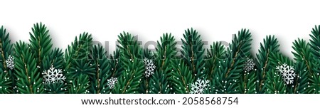 Merry Christmas fir tree branches garland with paper cut snowflakes on white background. Vector illustration. Holiday seamless border frame template, poster, brochure voucher design. Place for text. Royalty-Free Stock Photo #2058568754