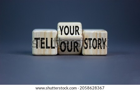 Tell our or your story. Turned wooden cubes and changed words tell our story to tell your story. Beautiful grey background, copy space. Business, storytelling and our or your story concept. Royalty-Free Stock Photo #2058628367