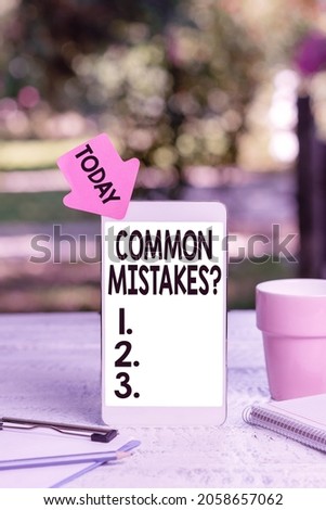 Text sign showing Common Mistakes Question. Word for repeat act or judgement misguided making something wrong Abstract Outdoor Smartphone Photography, Displaying New Device