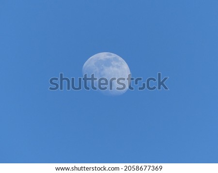 This picture shows the moon on a clear day.