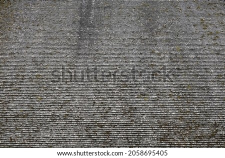  Shingle wooden tile facade background.Texture of old weathered wooden tiled roof or surface of natural veneer wall backdrop. Eco background. Environmental conservation, eco-friendly house concept    