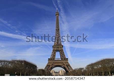 A vertical shot of the Eiffel Tower iconic landmark, Paris, France under the blue sky