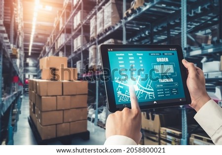 Warehouse management innovative software in computer for real time monitoring of goods package delivery . Computer screen showing smart inventory dashboard for storage and supply chain distribution . Royalty-Free Stock Photo #2058800021