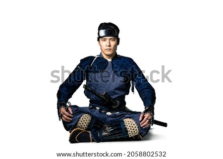 Sitting Japanese samurai. Japanese traditional warrior. Royalty-Free Stock Photo #2058802532