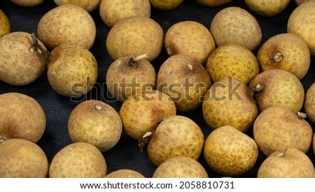 Fresh longans fruits background. Ripe longans close up