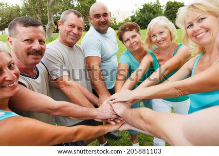 Happy people showing unity  Royalty-Free Stock Photo #205881103