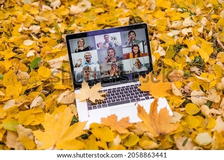 modern laptop in autumn landscape. videoconference