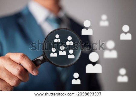 Concept of marketing to a certain target demographic. Employees that stand out from the crowd were chosen by the human resources officer. Royalty-Free Stock Photo #2058893597