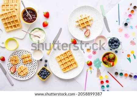 Kids waffle breakfast treat with clotted cream