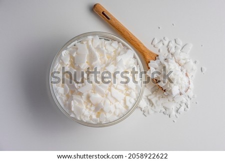 Set for crafting candle. Eco soy wax on white table. DIY candle. Hobby concept Royalty-Free Stock Photo #2058922622