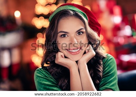 Photo of charming happy attractive woman santa helper good mood hands face xmas indoors inside house home