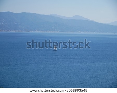 A sailboat sailing in the bay. Oct 2021 Royalty-Free Stock Photo #2058993548