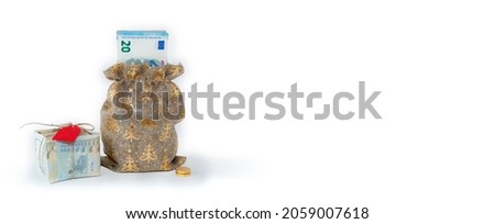 Money as a gift for the New Year and Christmas on a white background. An isolated image.