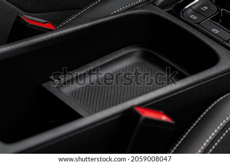 Car armrest opened. Opened armrest in the car for driver. Royalty-Free Stock Photo #2059008047