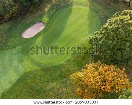 Aerial view of a golf cart with bunker and putting green  Photography taken from above with a drone in Partille in Sweden  Copy space 