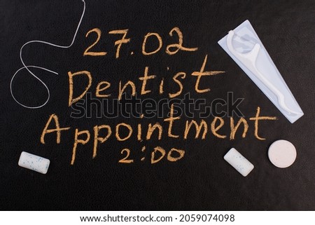 Dental care items and dentist appointment reminder.