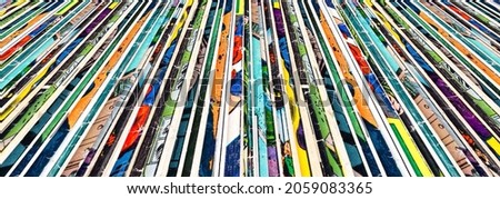 Old colorful comic books stacked in a row background texture