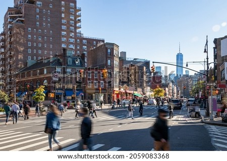 Crowds of people walking across a busy intersection on 7th Avenue in the West Village neighborhood of New York City NYC Royalty-Free Stock Photo #2059083368
