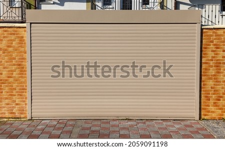 Automatic Roller shutter gates beige color close-up