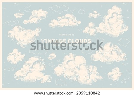 Vector collection of hand drawn clouds. Vintage sky, retro style illustration, cloudscape ink drawing. Nature background. Royalty-Free Stock Photo #2059110842