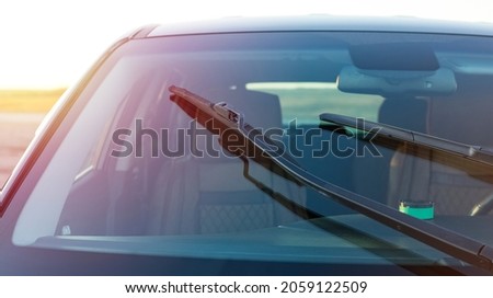 Car windshield brushes. Concept for cleaning products, polishing, anti-rain Royalty-Free Stock Photo #2059122509