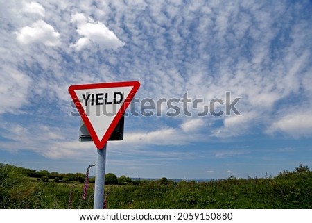 Yield sign in a country road in Crosshaven, County Cork, Ireland