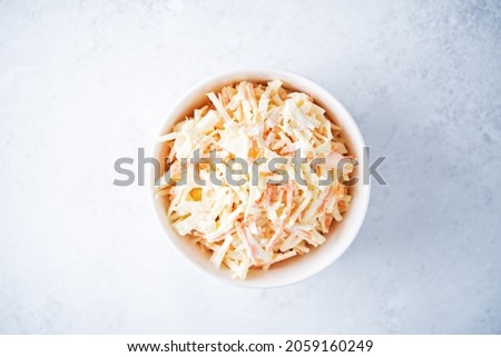 Coleslaw, cabbage carrot salad with greek yogurt dressing in a bowl. selective focus