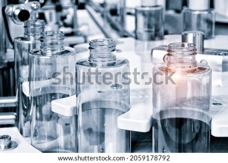 pharmaceutical industry, medicine pills are filling in the  bottle on production line machine conveyor at the medical factory. selective focus.