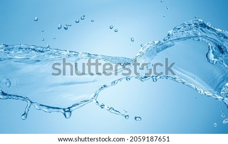 Water splash isolated on blue background