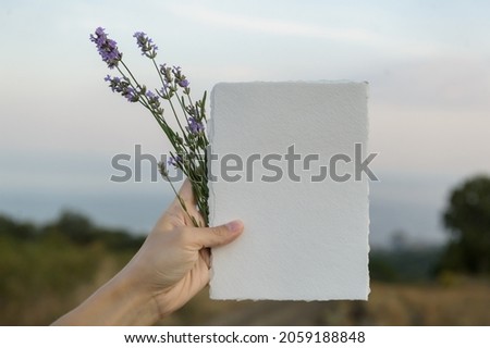 White blank paper sheet card mockup with copy space on landscape background. Summer stationery mock-up scene. Top view minimal business brand, wedding invitation  template