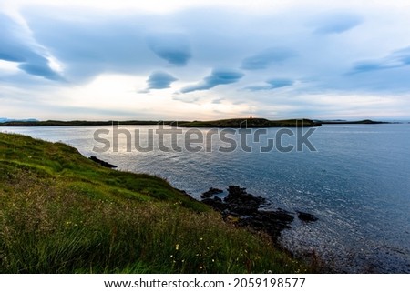 sunset from the headland of the Sugandisey peninsula over the port of Stikkysholmur in West Iceland