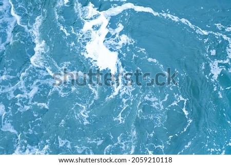 Strong swirl of water for the background. Water waves